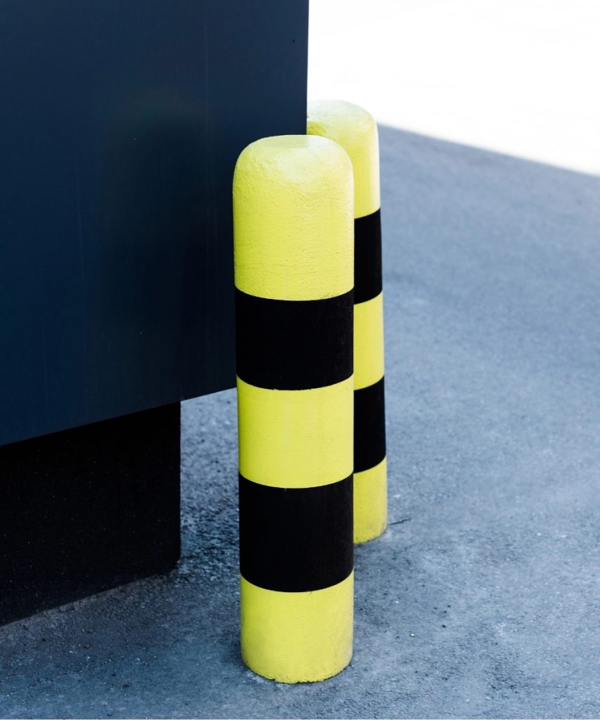 Protective bollards installed near building entrance